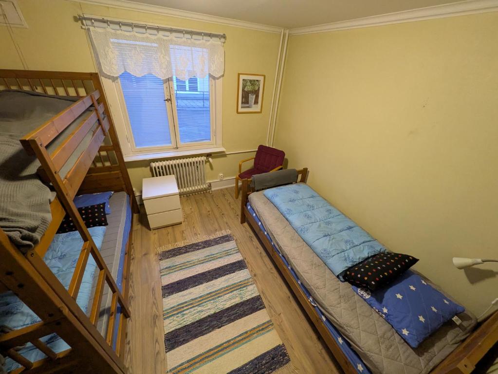 Postel nebo postele na pokoji v ubytování Hostel Räntmästaregården