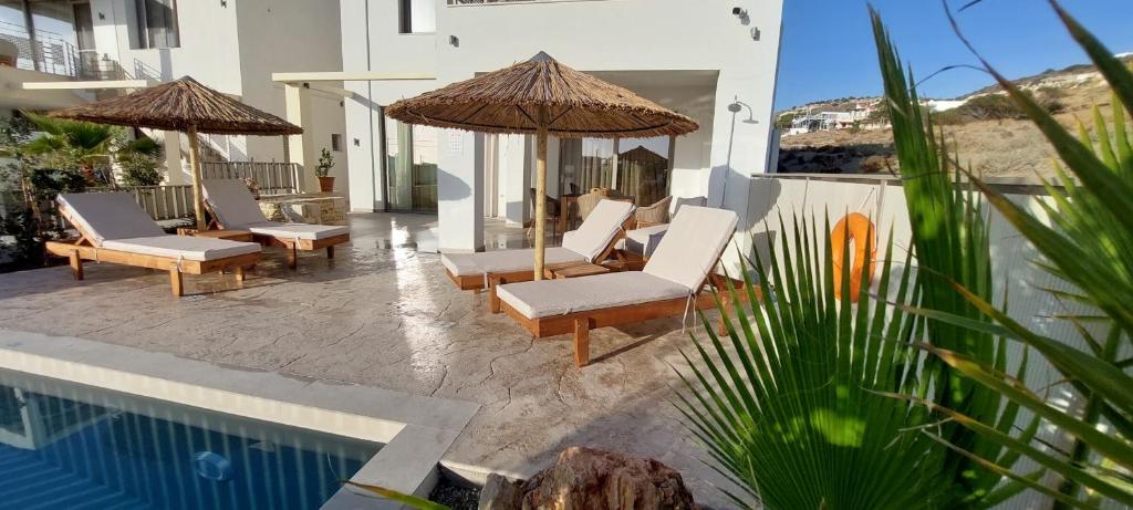 The swimming pool at or close to Ammokrinos Luxury Homes, 150m From Sea