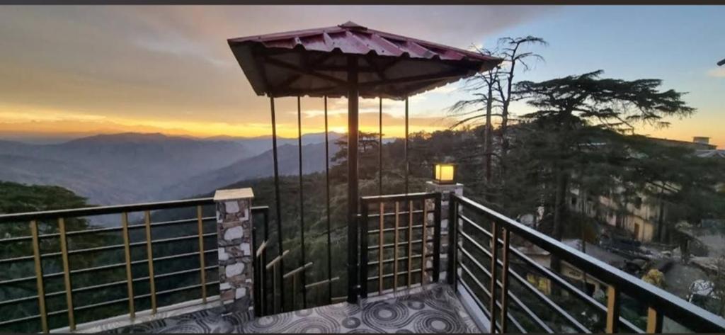 a balcony with a view of the mountains at RATAN HOMES Sunrise Valley in Jāmb