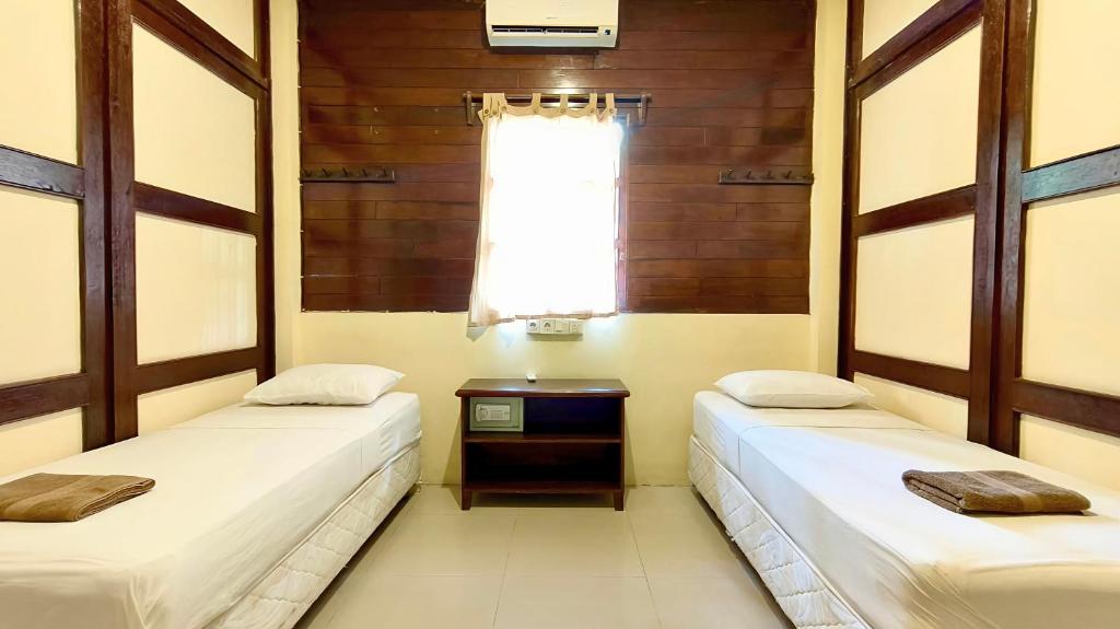 Postel nebo postele na pokoji v ubytování Gili Buana Hostel & Backpackers Gili Air