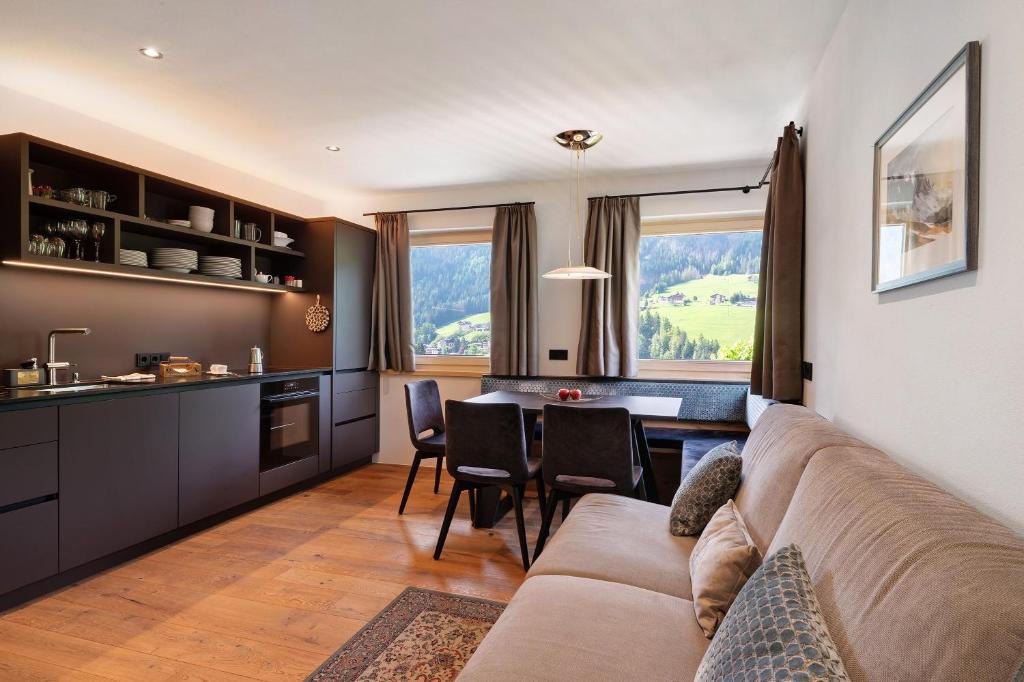 a living room with a couch and a table at Apartment Vista Stlarida in Ortisei