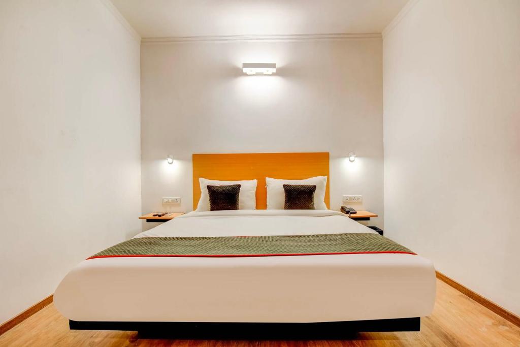 Postel nebo postele na pokoji v ubytování Hotel O Star Key