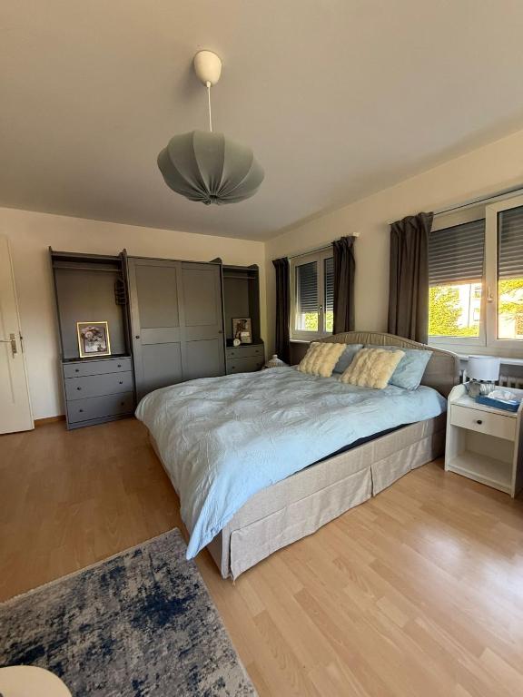 Postel nebo postele na pokoji v ubytování MTL Schweiz Apartments