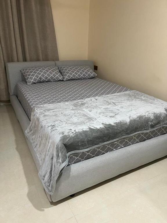 Postel nebo postele na pokoji v ubytování Hiri Inn