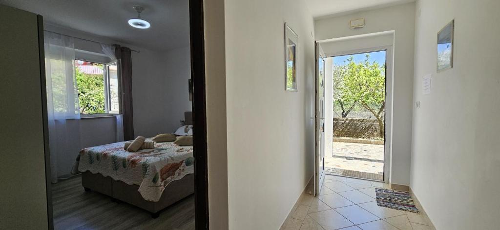 Postel nebo postele na pokoji v ubytování Apartment Nika