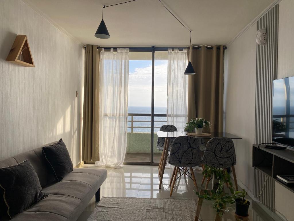 Телевизор и/или развлекательный центр в Departamento frente al Mar en sector de Parque Playa Brava