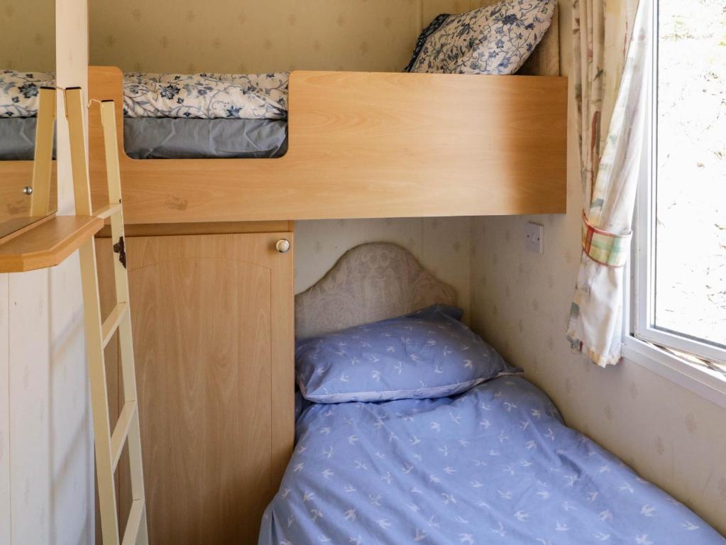 Postel nebo postele na pokoji v ubytování The CaravanMeenacross