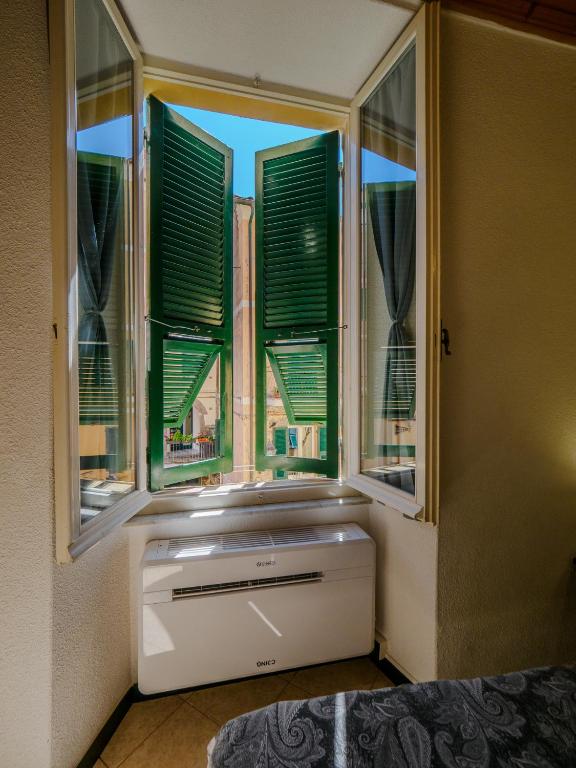 Postel nebo postele na pokoji v ubytování Macaia Room #1 with AC