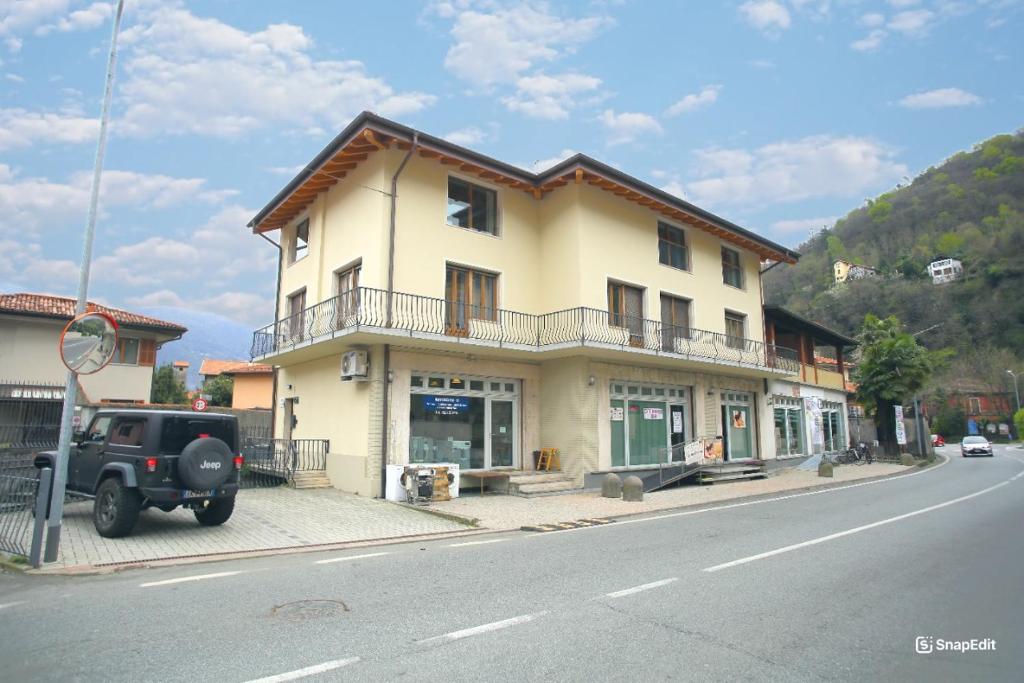 a large building on the side of a street at Casa Camoscio Piano 2 in Cannobio