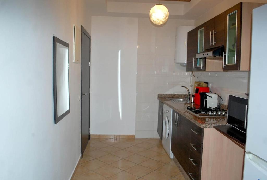 Kuchyň nebo kuchyňský kout v ubytování Appartement Riviera Beach Cabo