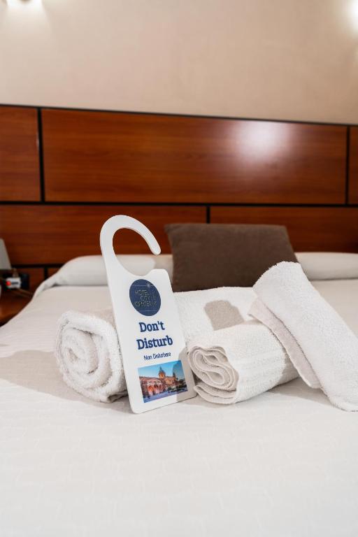 Postel nebo postele na pokoji v ubytování Hotel City Center