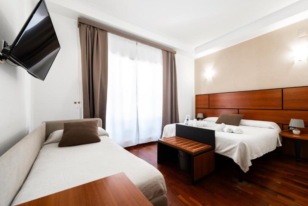 Postel nebo postele na pokoji v ubytování Hotel City Center