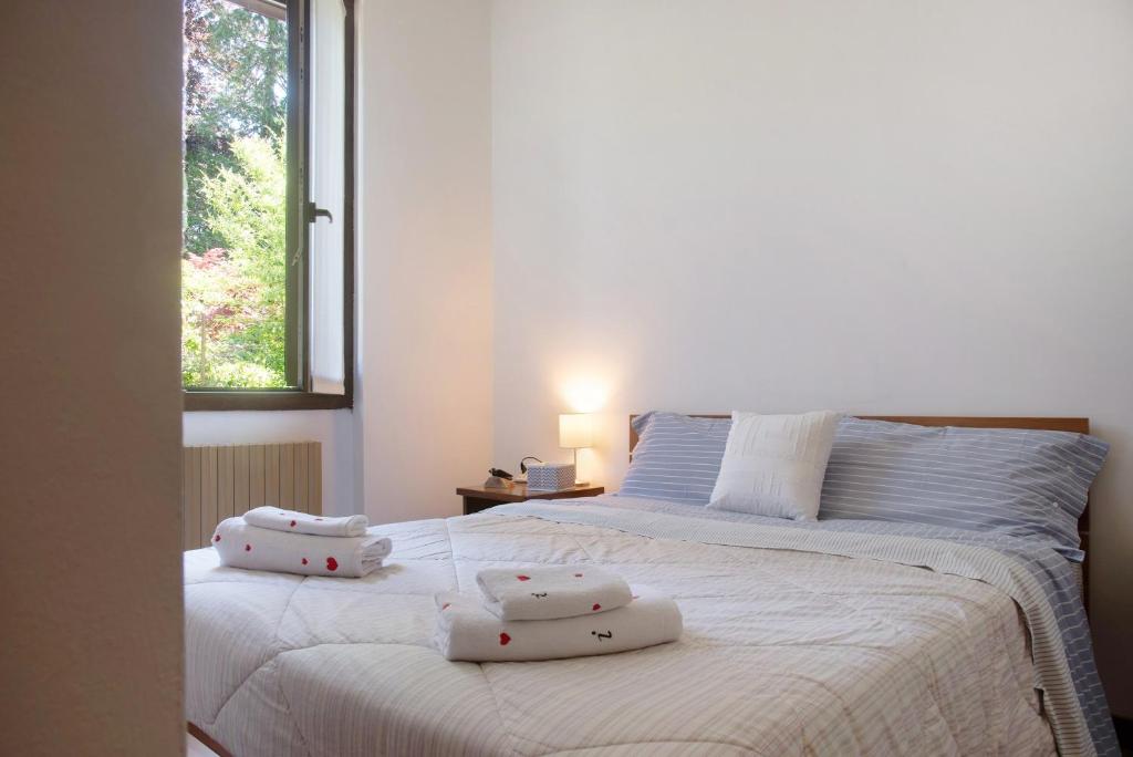 Posteľ alebo postele v izbe v ubytovaní Villa Olga Lago Maggiore