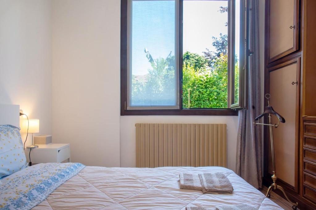 Posteľ alebo postele v izbe v ubytovaní Villa Olga Lago Maggiore