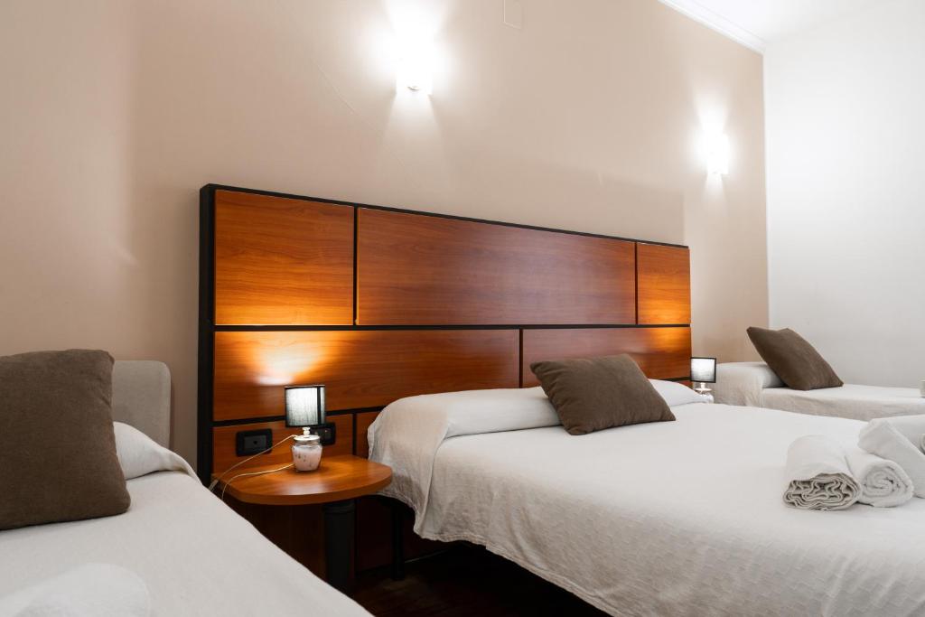 Postel nebo postele na pokoji v ubytování Hotel City Center