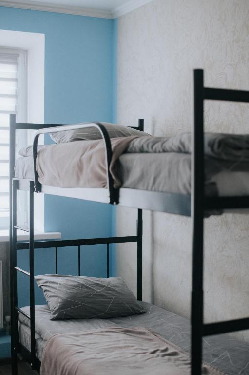 a room with three bunk beds in a room at 4ua-хостел in Bratslav