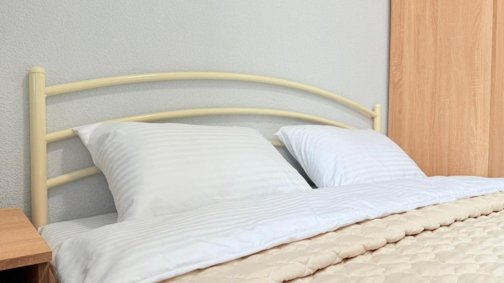 Postel nebo postele na pokoji v ubytování Centerline Apartments