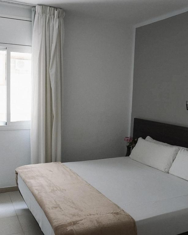 Postel nebo postele na pokoji v ubytování Hotel Ram Rooms Tahiti