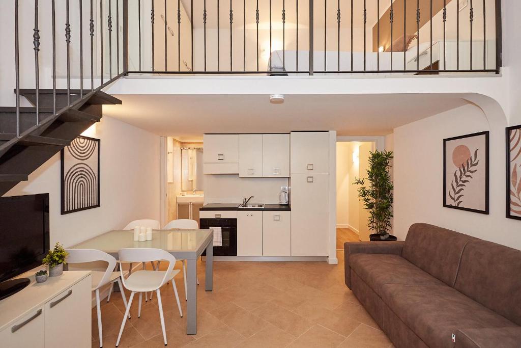 a living room with a couch and a table at Broglio Studios in Milan