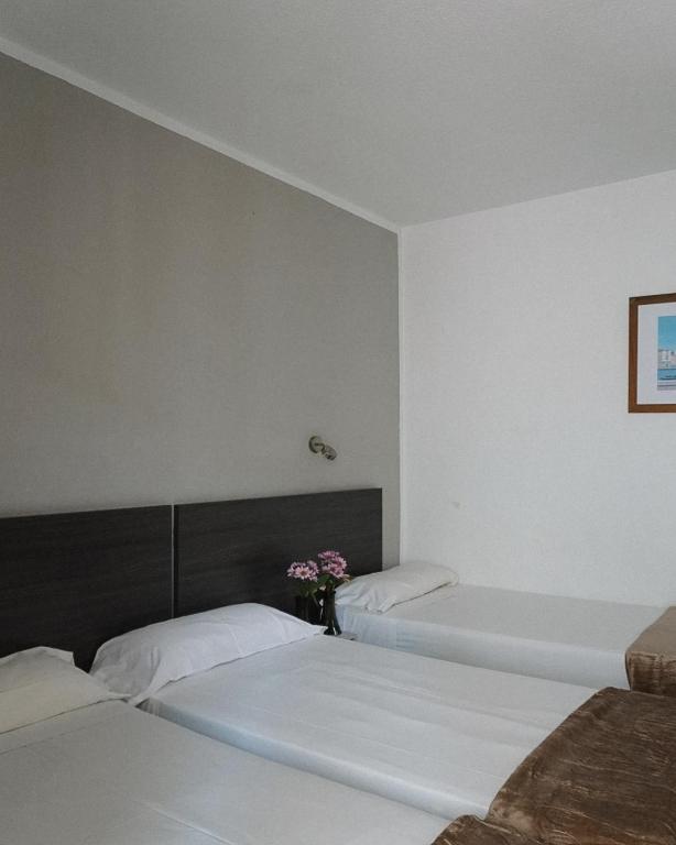 Postel nebo postele na pokoji v ubytování Hotel Ram Rooms Tahiti