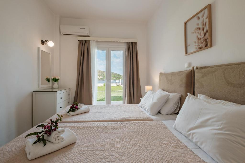 Postel nebo postele na pokoji v ubytování Kalamionas Studios & Apartments
