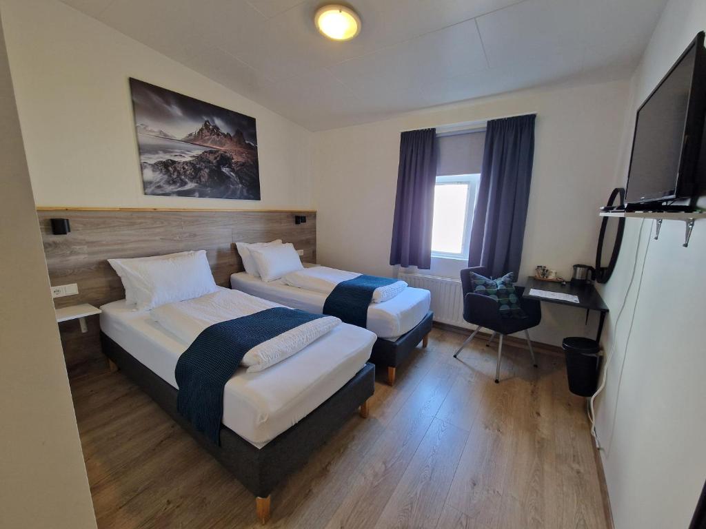 Postel nebo postele na pokoji v ubytování Guesthouse Mikael