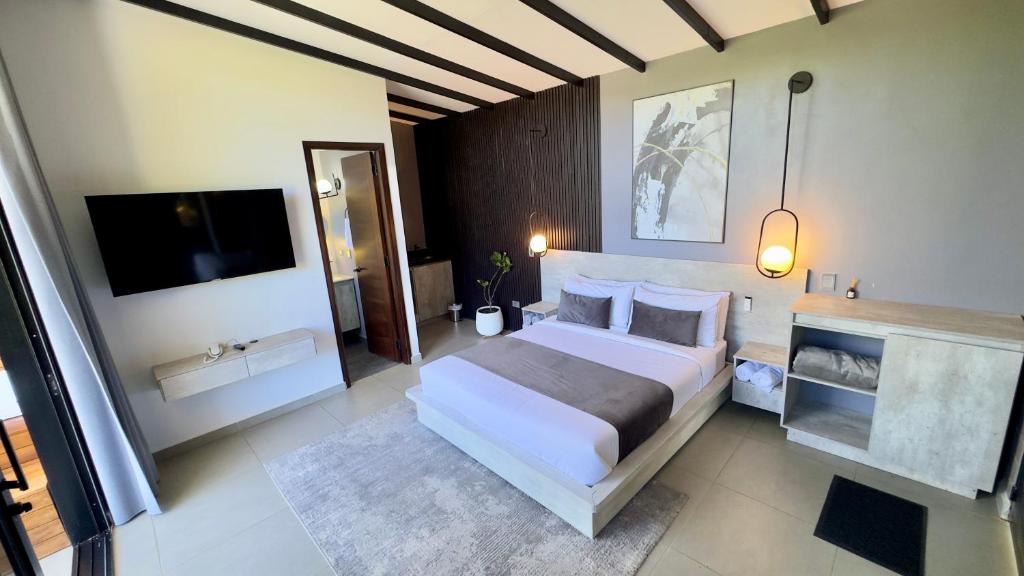 Postel nebo postele na pokoji v ubytování Rooca Habitat Guatape
