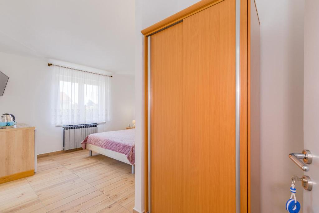 Postel nebo postele na pokoji v ubytování Bed and Breakfast Ema