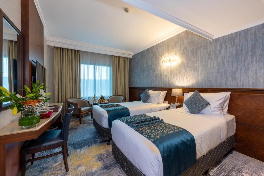 Katil atau katil-katil dalam bilik di Nozol Royal Inn Hotel