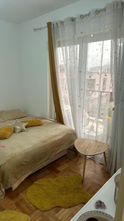 Postel nebo postele na pokoji v ubytování PANZIONERA Apartment Center