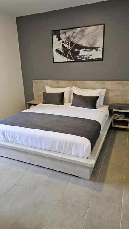 Postel nebo postele na pokoji v ubytování Rooca Habitat Guatape