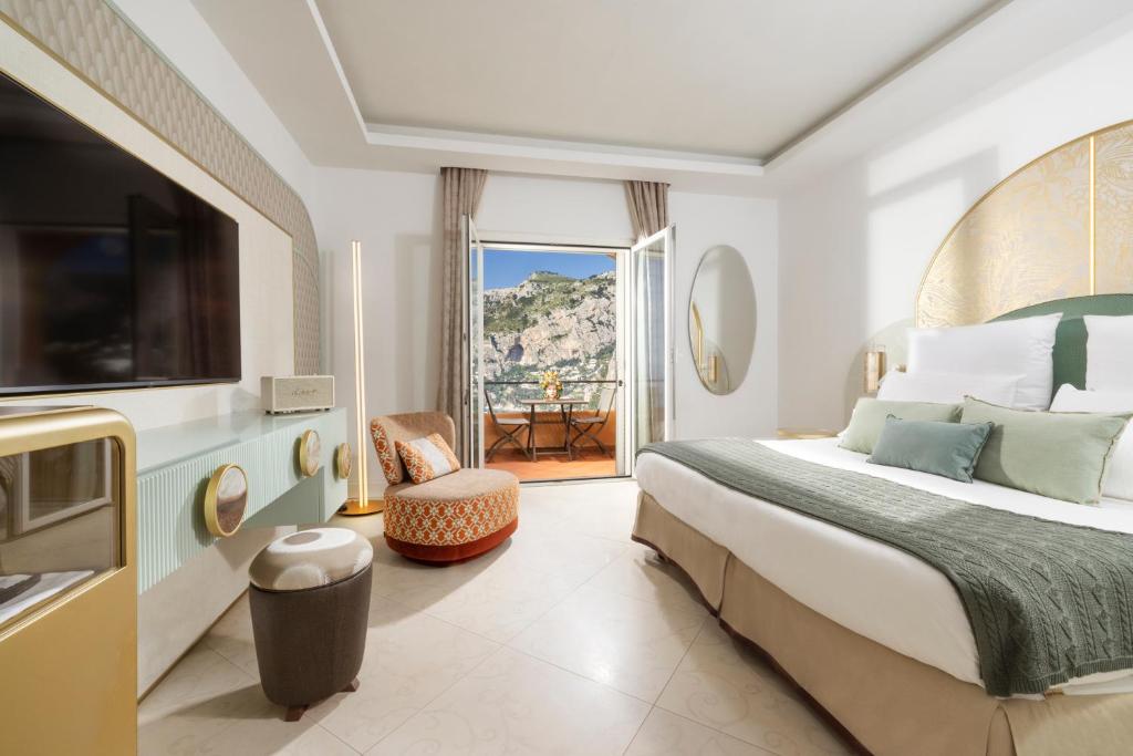 Llit o llits en una habitació de Hotel Punta Tragara