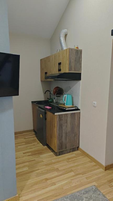 a small kitchen with a sink in a room at 777tsrj in Muruntau