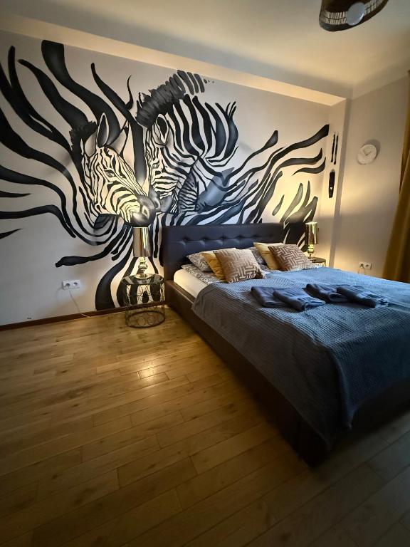 Posteľ alebo postele v izbe v ubytovaní Africa Apartment