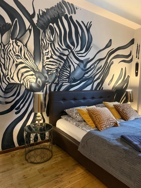 Posteľ alebo postele v izbe v ubytovaní Africa Apartment