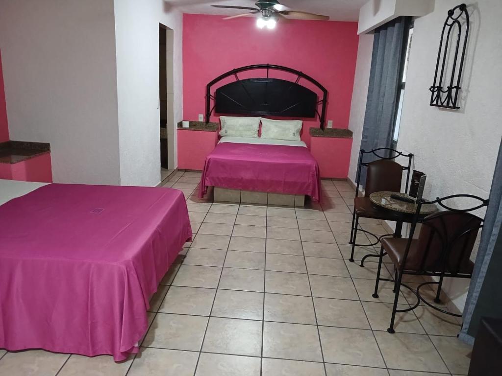 Postel nebo postele na pokoji v ubytování HOTEL SOL