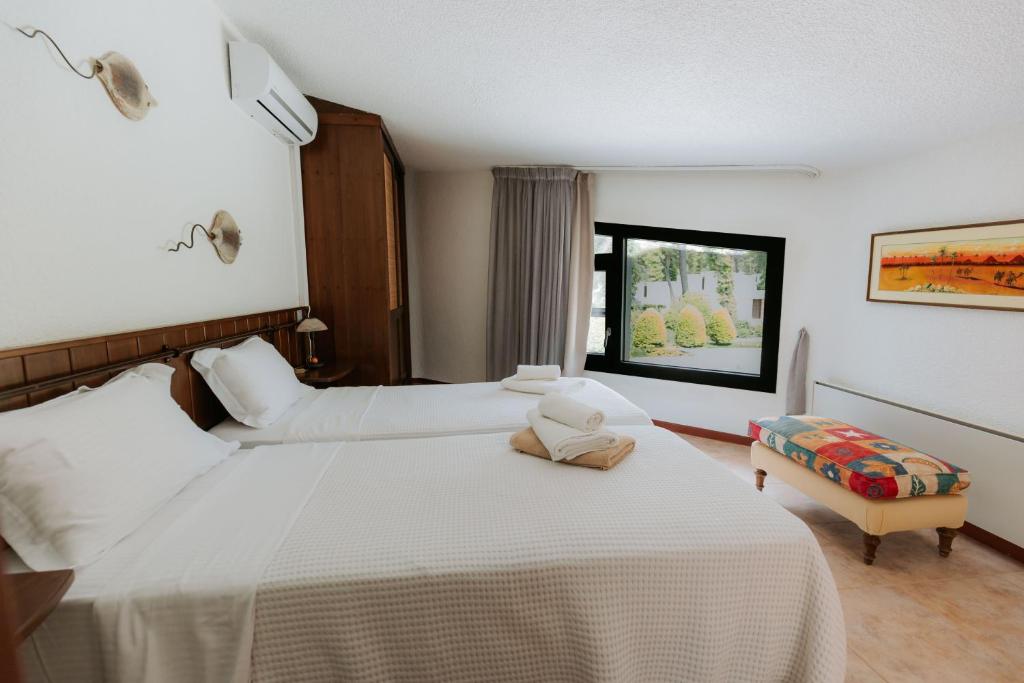 A bed or beds in a room at Sani Green Villa