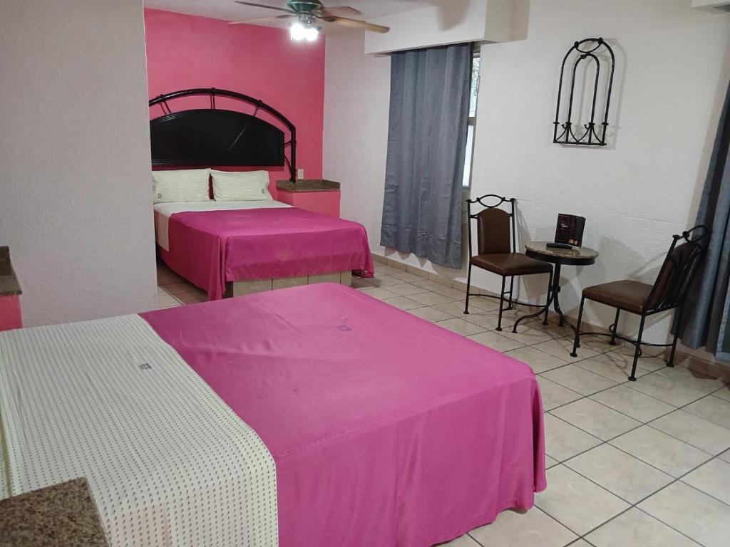 Postel nebo postele na pokoji v ubytování HOTEL SOL