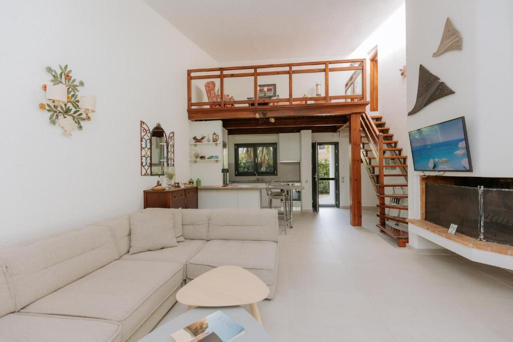 A television and/or entertainment centre at Sani Green Villa