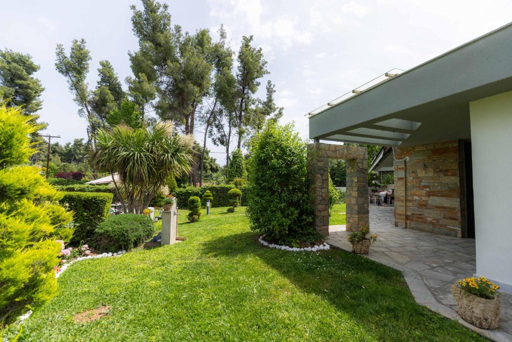 A garden outside Sani Green Villa