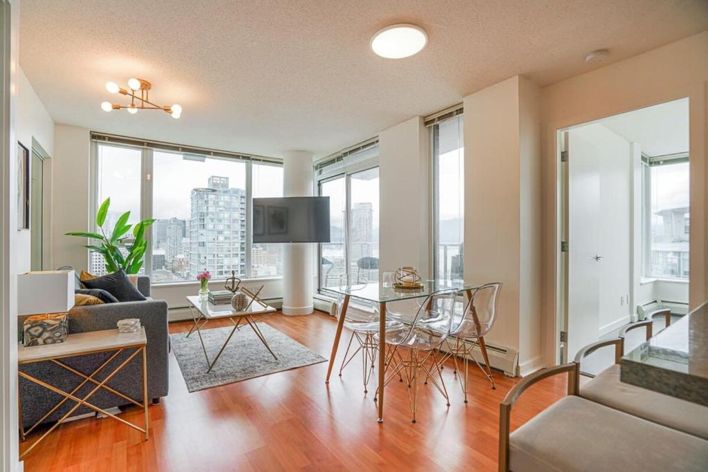 a living room with a couch and a table at Executive Unit with Spectacular Views in Vancouver