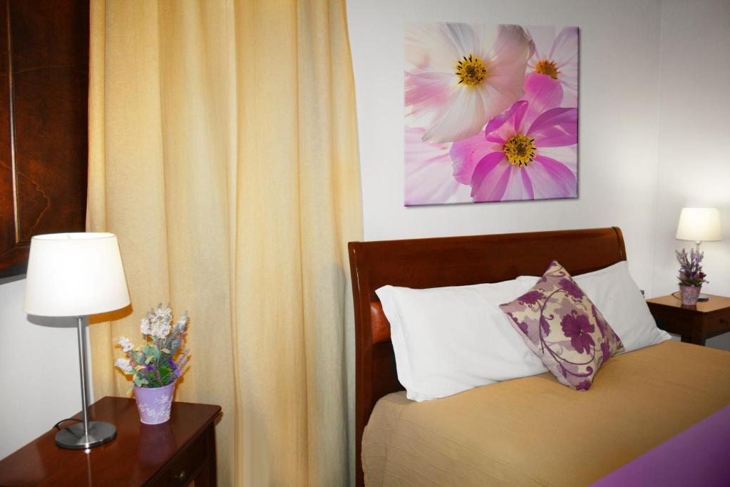 Letto o letti in una camera di Roma Resort Termini
