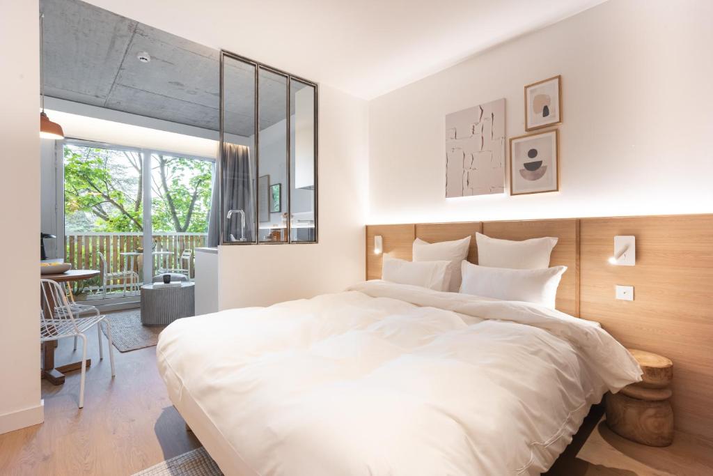 Postel nebo postele na pokoji v ubytování Babel Community Hôtel Lille - Villeneuve d'Ascq