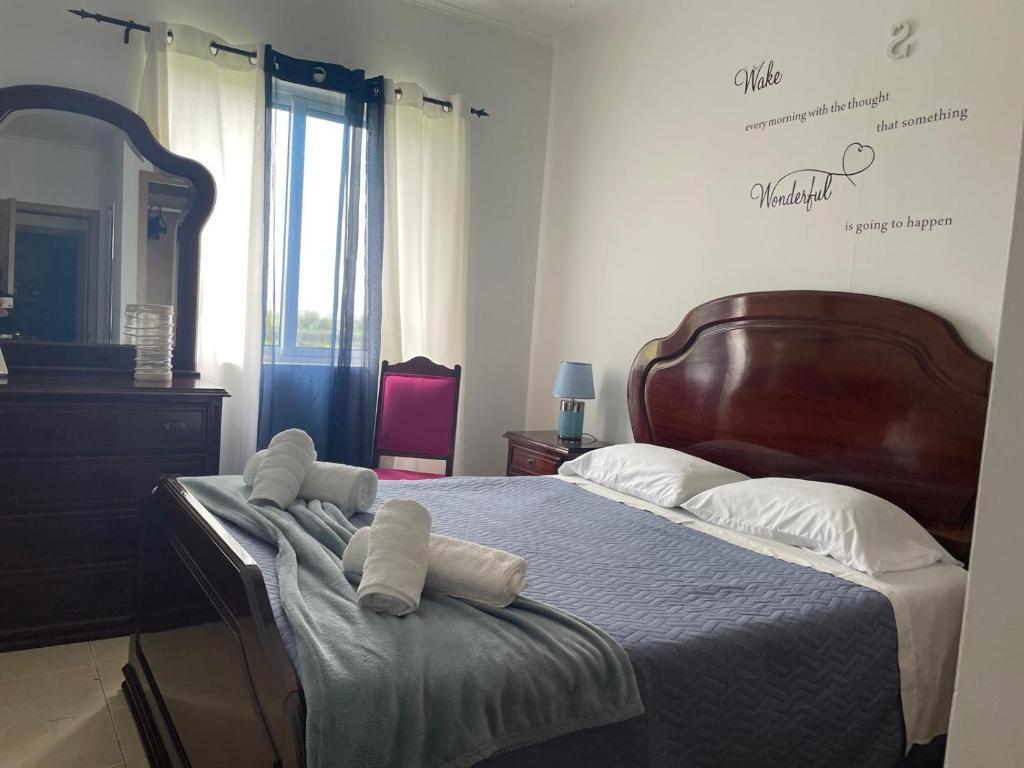 En eller flere senge i et værelse på Apartamento Sandra