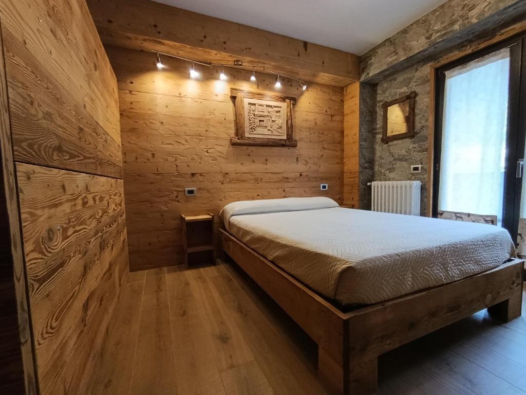 Posteľ alebo postele v izbe v ubytovaní BERTUZZI HOMES "Bertuzzi Luxury Chalet"