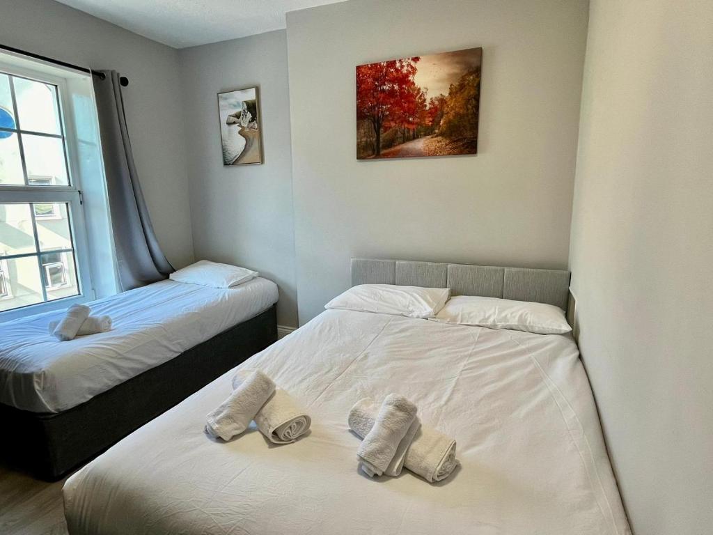 Postel nebo postele na pokoji v ubytování Shamrock Inn