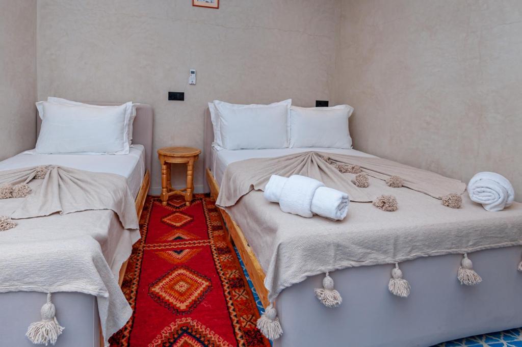Postel nebo postele na pokoji v ubytování Riad Akkioui