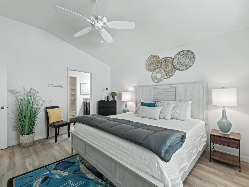 a bedroom with a bed and a ceiling fan at 5682 Z6 VILLAGE OF DESOTO by REMAX Premier in The Villages