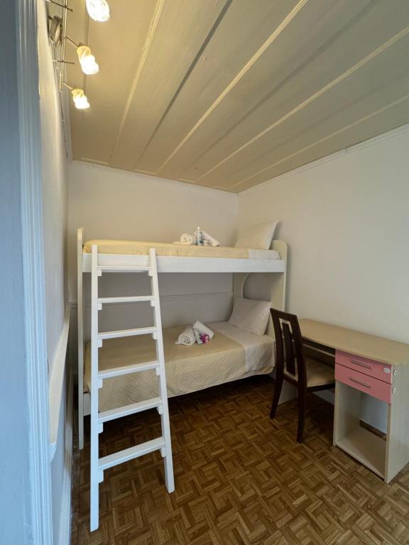 a room with a bunk bed with a ladder and a desk at Vistas Venecianas Corfu in Corfu