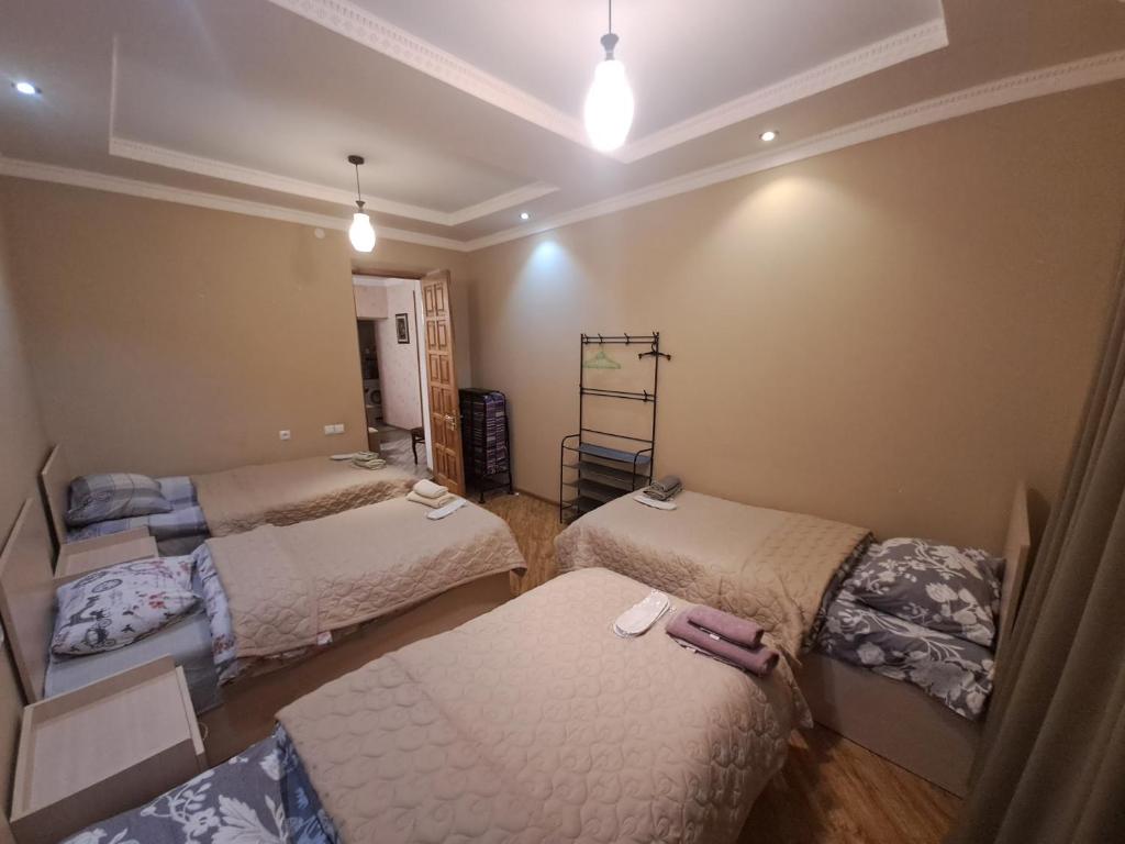 Llit o llits en una habitació de Guest House "AKHALTSIKHE"